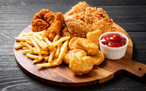 Fried chicken with french fries and nuggets meal - junk food and unhealthy food