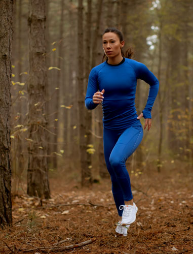 woman running in the woods